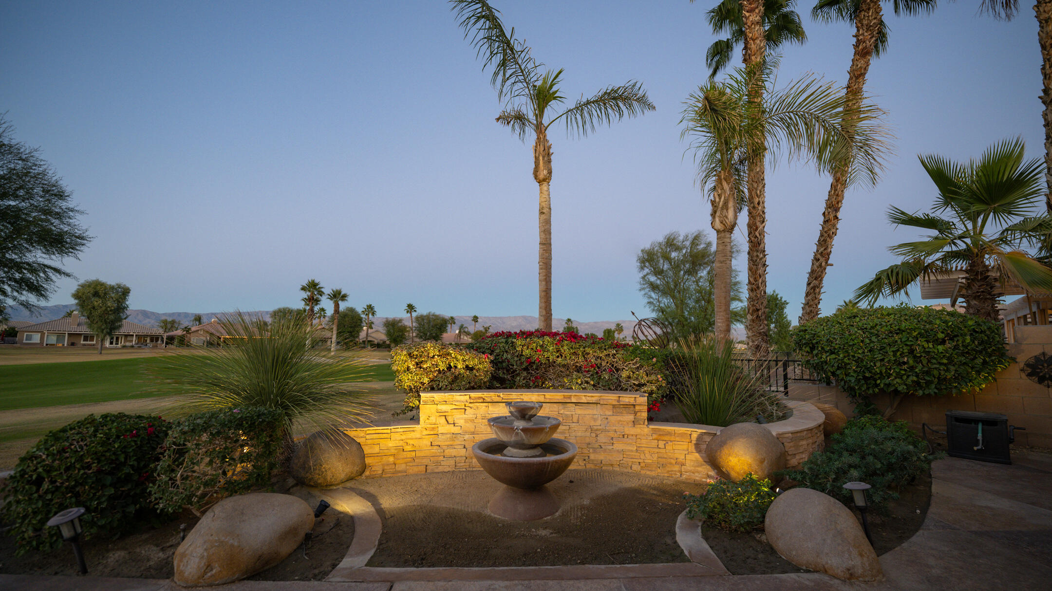 80290 Pebble Beach Drive Indio, CA 92201 - Photo 33 of 44 a view of a backyard with plants and palm trees