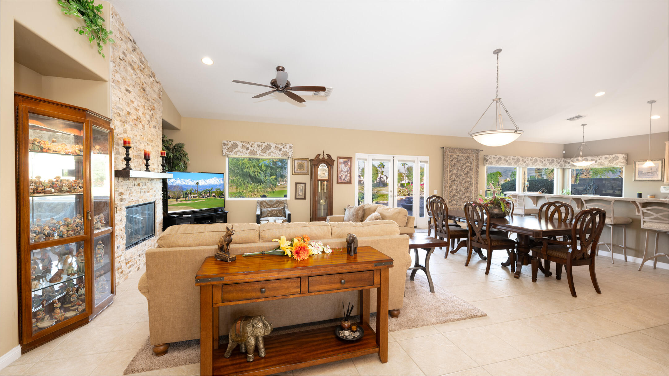 80290 Pebble Beach Drive Indio, CA 92201 - Photo 8 of 44 a dining room with furniture a chandelier and wooden floor
