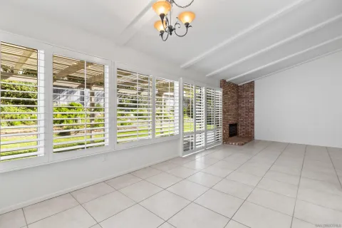 a view of an empty room with a fireplace