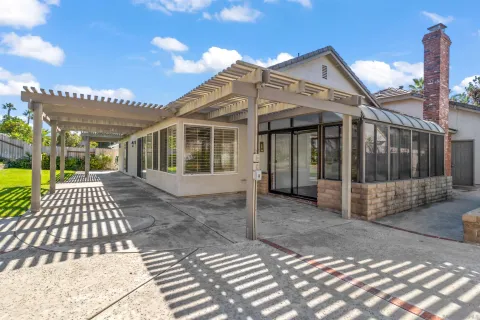 a view of a backyard with sitting area