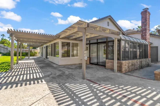 a view of a backyard with sitting area