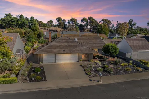 an aerial view of a house with a garden