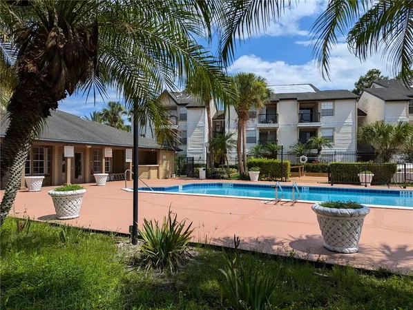 a view of a swimming pool with a patio