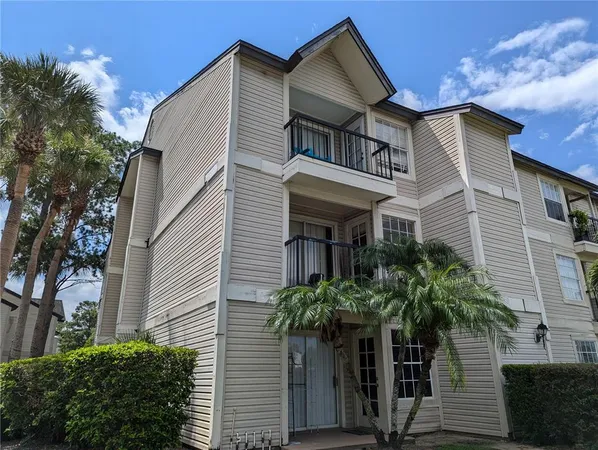 a view of a palm trees front of a house