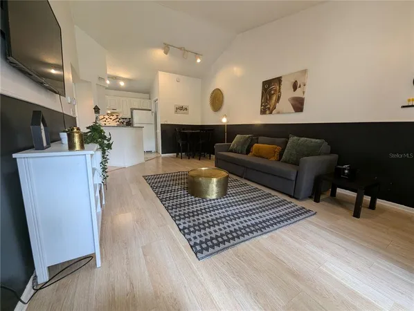 a living room with furniture and a rug