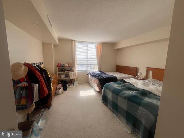 11710 Old Georgetown Road, Unit 602 North Bethesda, MD 20852 - Photo 16 of 22 a bedroom with bed and a closet