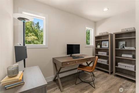 a workspace with furniture and window