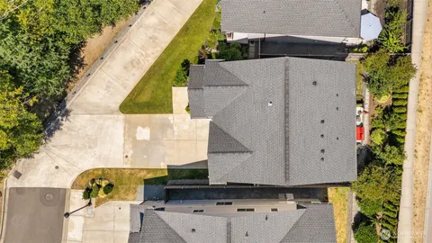 an aerial view of a house with a swimming pool