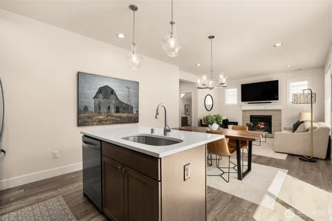 a view of living room kitchen island furniture and a fireplace