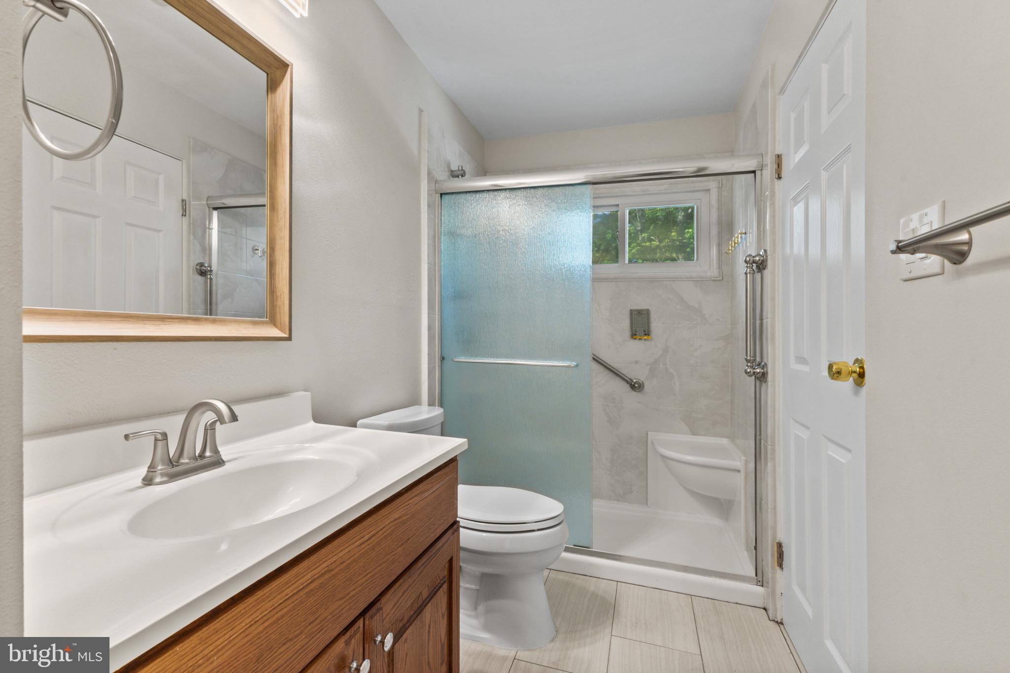 403 West Poplar Road Sterling, VA 20164 - Photo 8 of 25 Modern bathroom with sleek finishes.
