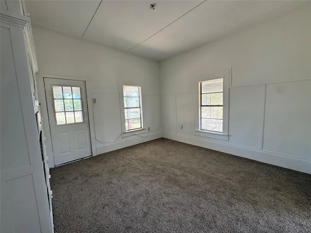 an empty room with windows