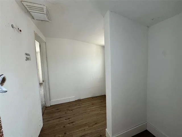 a view of small space with wooden floor