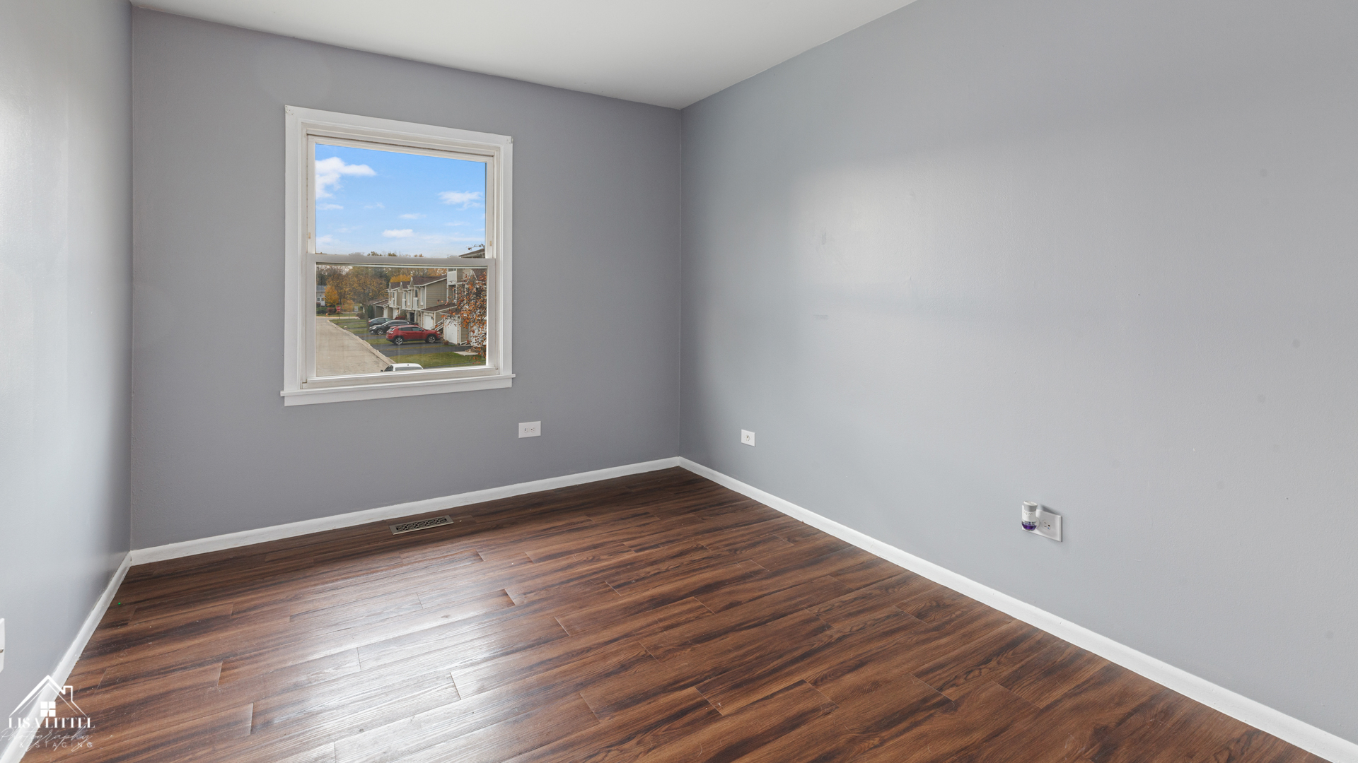 470 Degas Circle Bolingbrook, IL 60440 - Photo 11 of 22 a view of an empty room with wooden floor and a window
