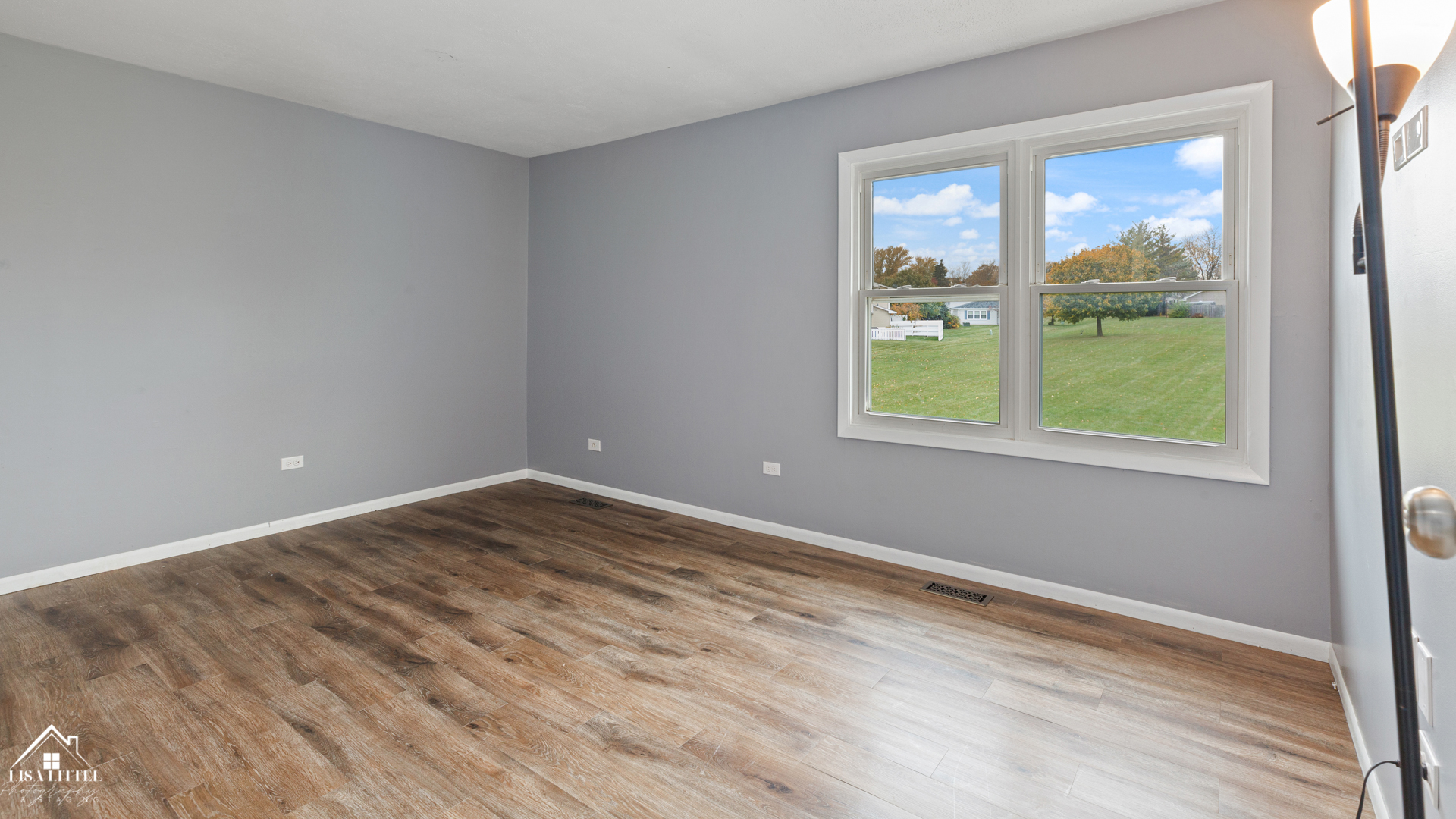 470 Degas Circle Bolingbrook, IL 60440 - Photo 12 of 22 a view of an empty room with wooden floor and a window