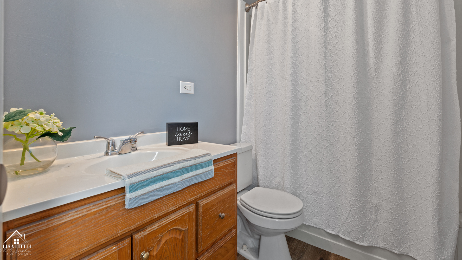 470 Degas Circle Bolingbrook, IL 60440 - Photo 19 of 22 a bathroom with a sink a toilet and shower curtain