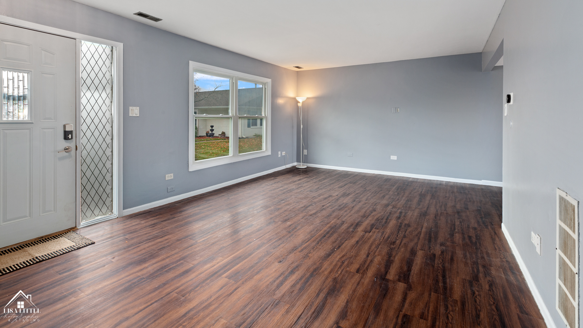 470 Degas Circle Bolingbrook, IL 60440 - Photo 3 of 22 a view of an empty room with wooden floor and a window
