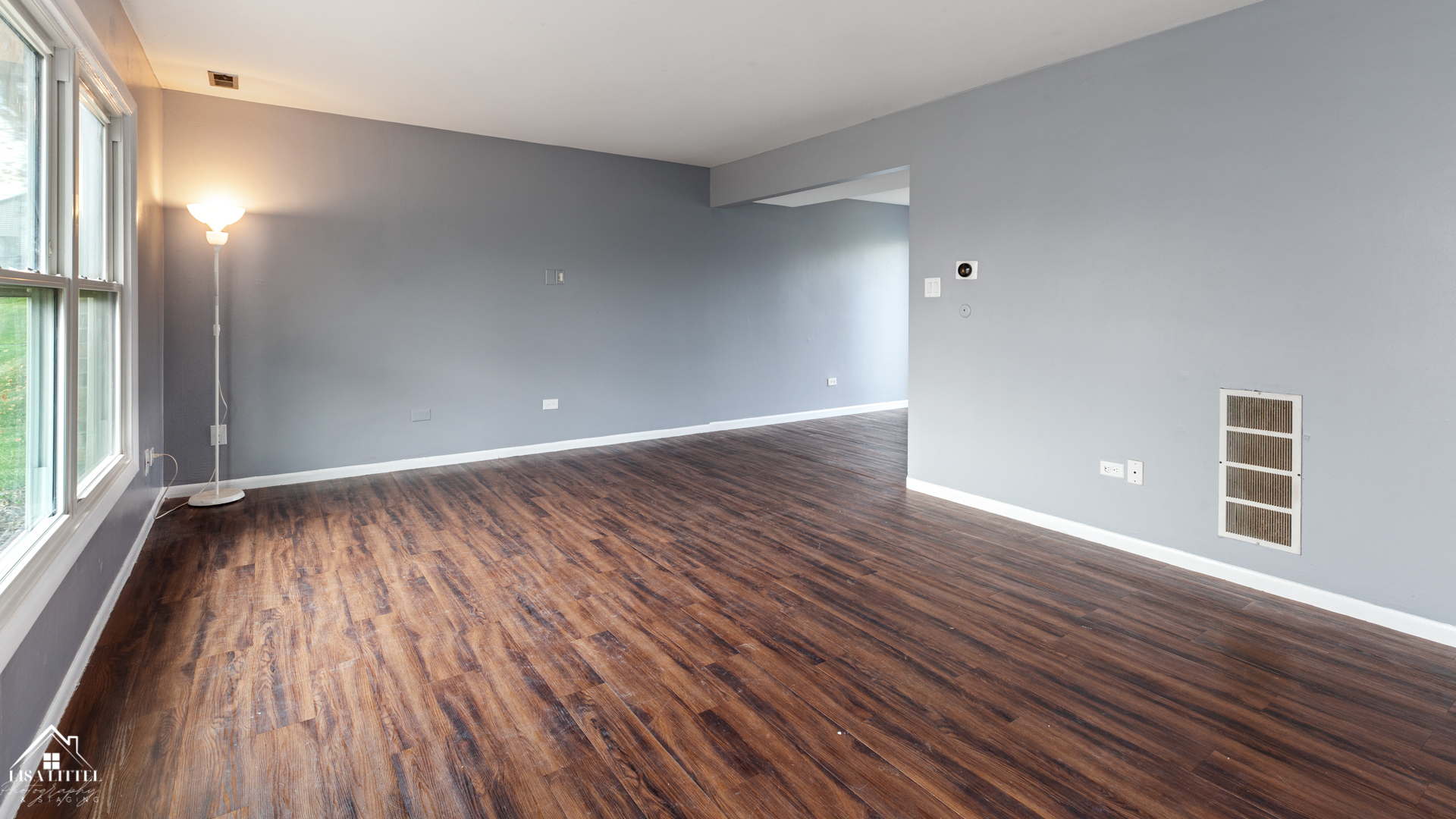 470 Degas Circle Bolingbrook, IL 60440 - Photo 4 of 22 a view of an empty room with wooden floor and a window