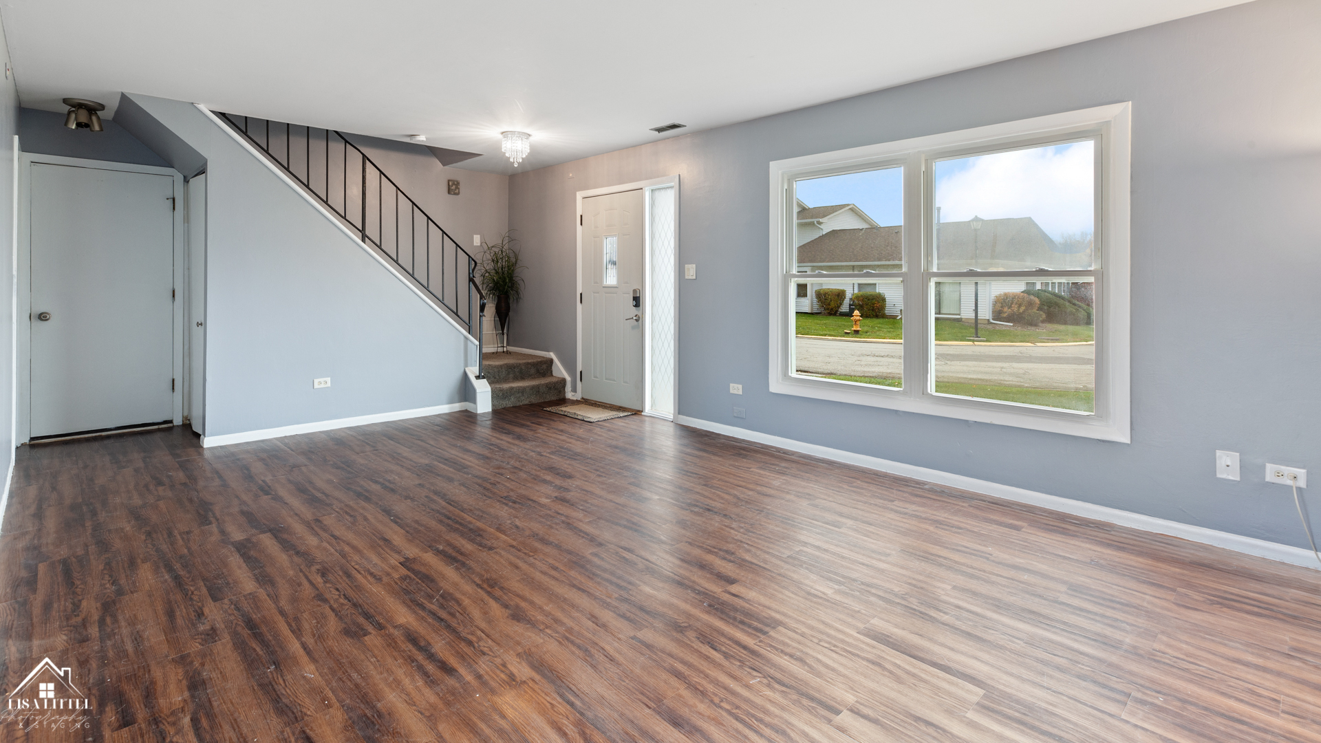 470 Degas Circle Bolingbrook, IL 60440 - Photo 5 of 22 a view of an empty room with wooden floor and a window