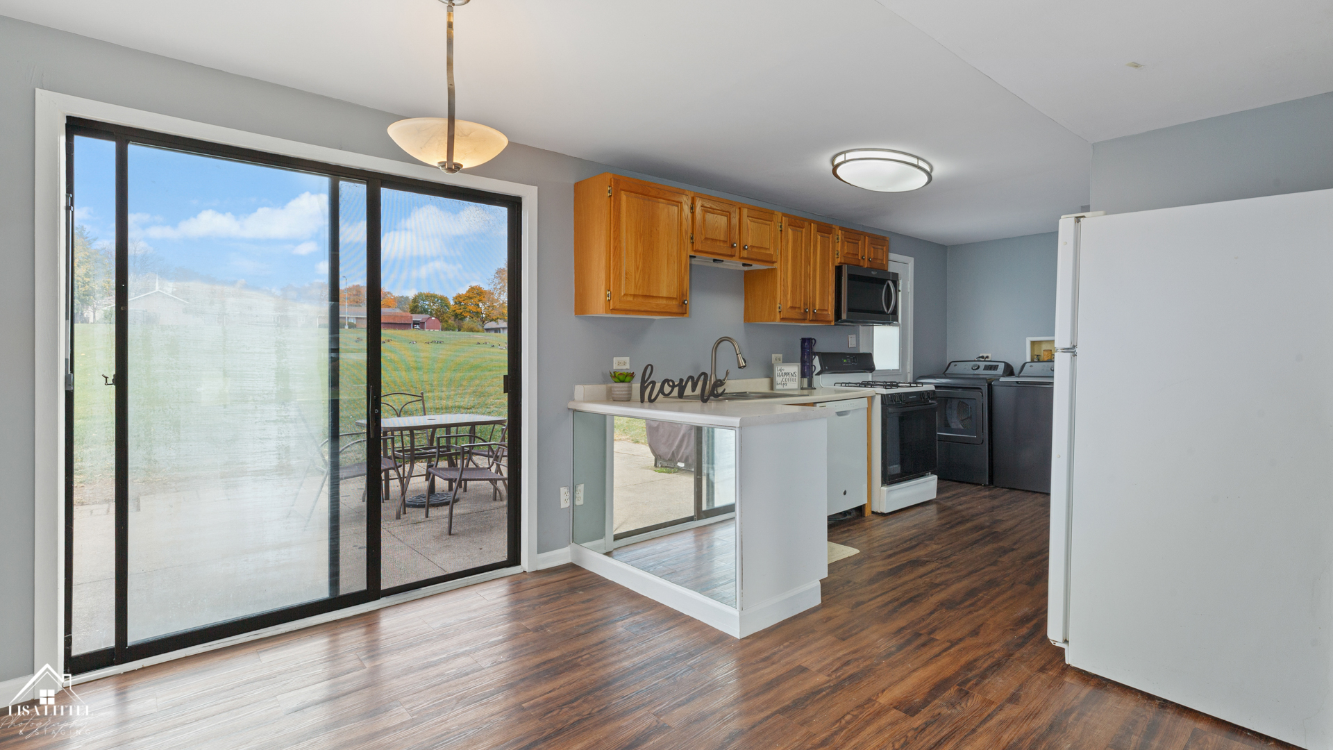 470 Degas Circle Bolingbrook, IL 60440 - Photo 8 of 22 a kitchen with stainless steel appliances granite countertop a refrigerator a sink a stove and white cabinets with wooden floor