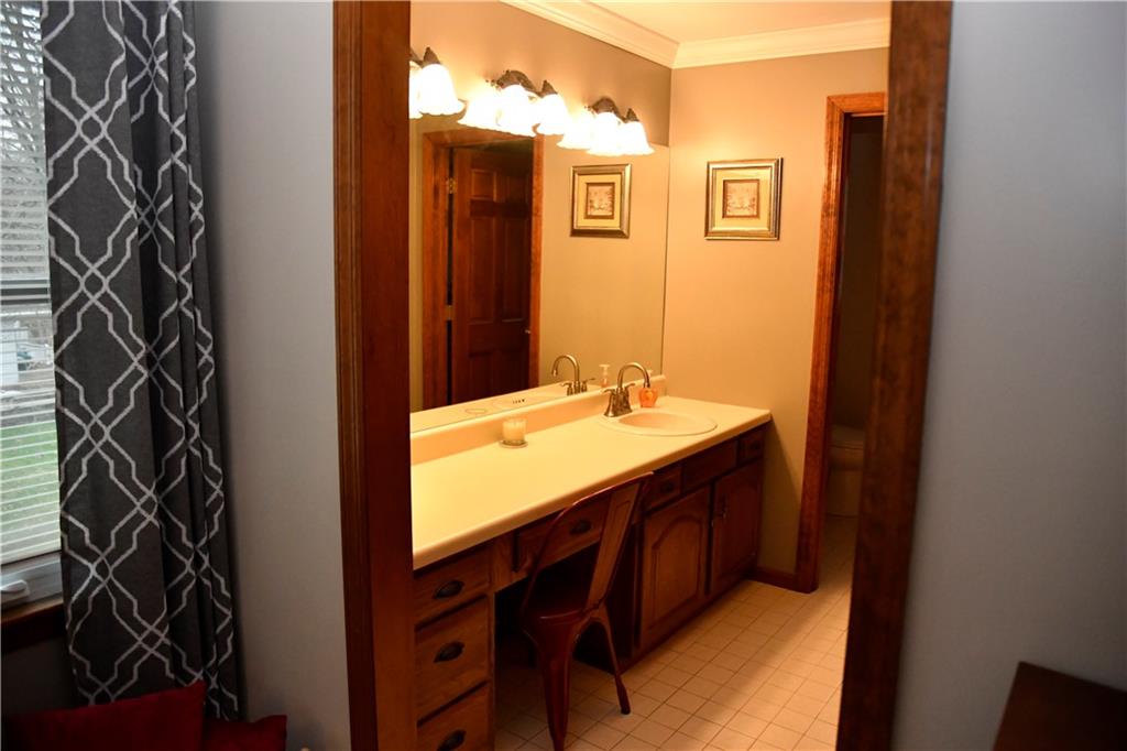 110 Firethorn Road Baden, PA 15005 - Photo 23 of 43 a bathroom with a sink and a mirror