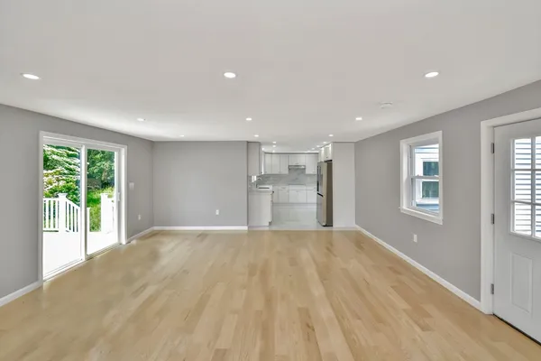 a view of a kitchen with large windows