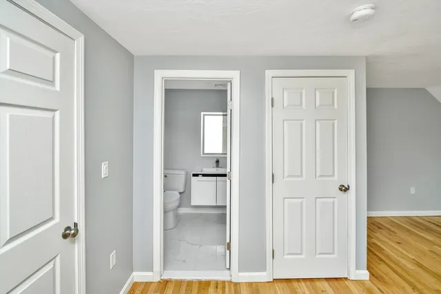 wooden floor with white walls