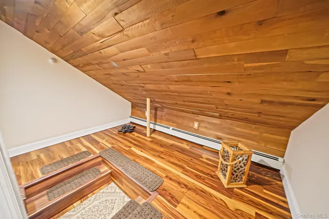 a view of balcony with wooden floor