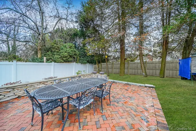 a view of backyard with seating and green space