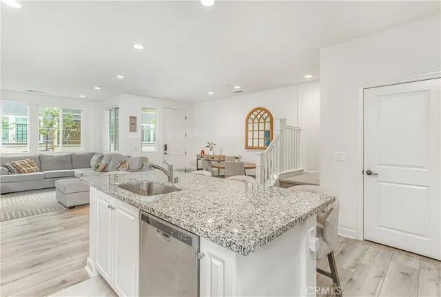 a living room with granite countertop furniture and fireplace
