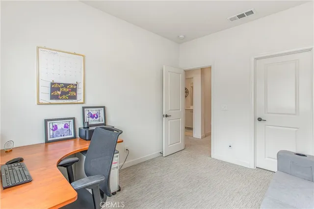 a workspace with furniture and a window