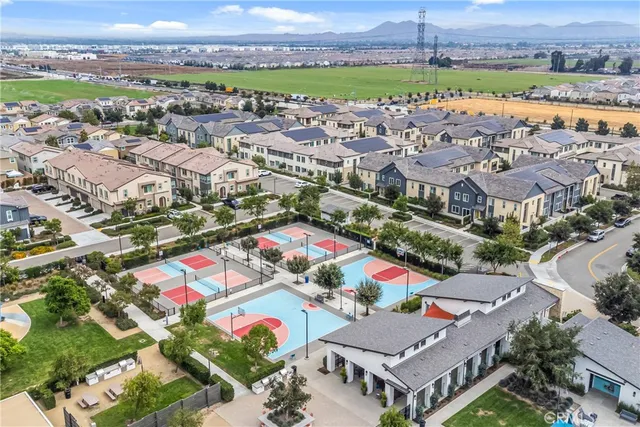 an aerial view of residential building and lake