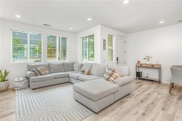 a living room with furniture and windows