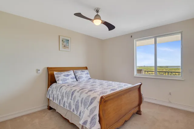 a view of a patio with couches table and chairs and potted plants