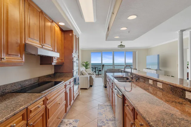 a view of a lake with couches in the back