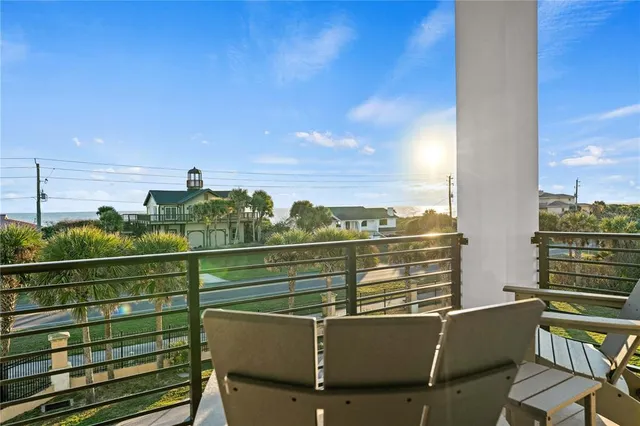 a bedroom with a bed and a flat tv screen on dresser
