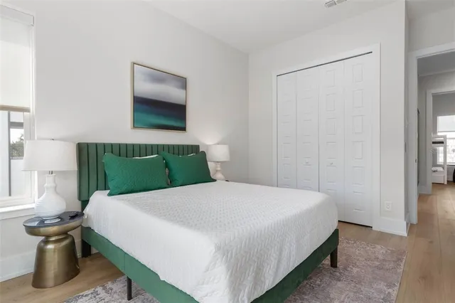 a bathroom with a granite countertop sink a toilet and a mirror