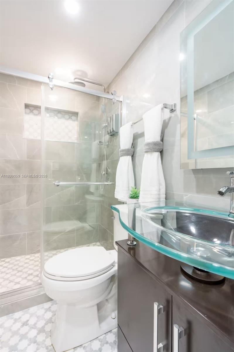 1721 Southwest 11th Terrace Miami, FL 33135 - Photo 17 of 60 a bathroom with a sink and a mirror