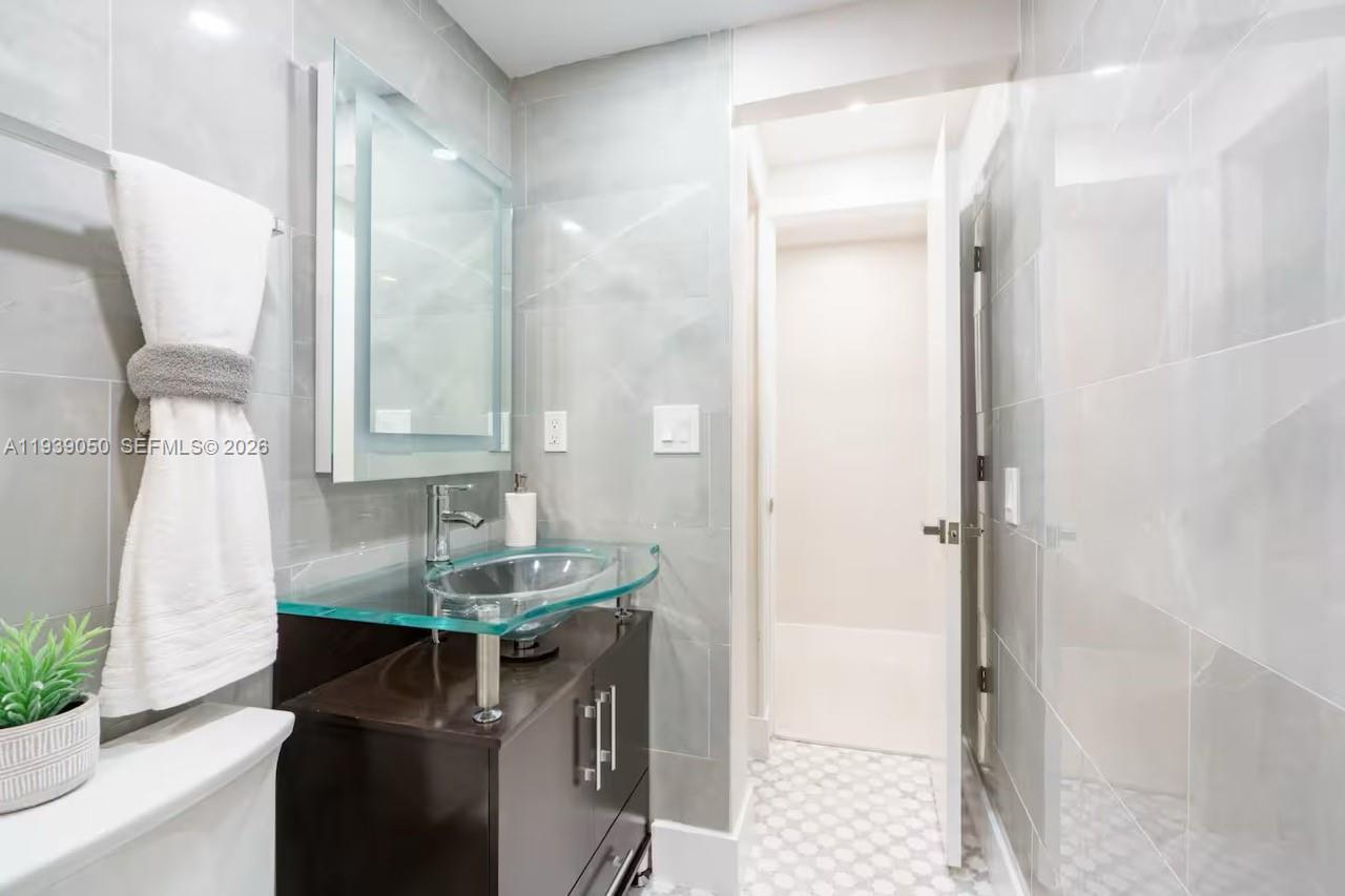 1721 Southwest 11th Terrace Miami, FL 33135 - Photo 18 of 60 a bathroom with a sink and a mirror