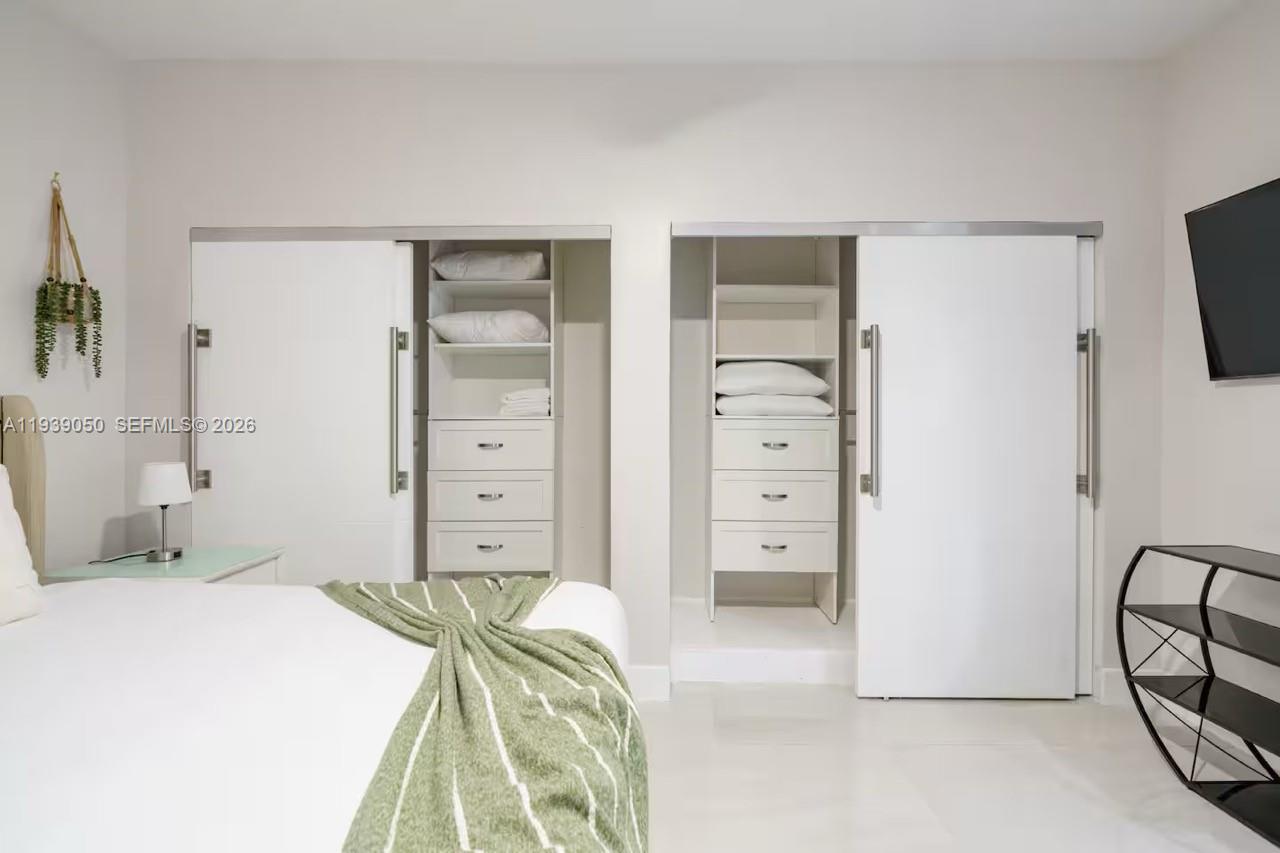 1721 Southwest 11th Terrace Miami, FL 33135 - Photo 22 of 60 a bedroom with a bed and a view of bedroom