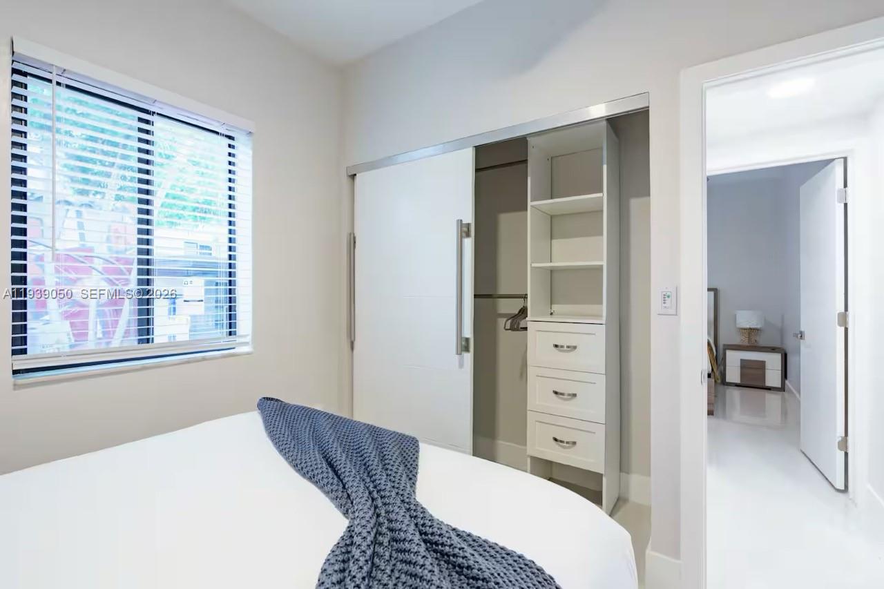 1721 Southwest 11th Terrace Miami, FL 33135 - Photo 24 of 60 a bedroom with a bed and a view of bathroom