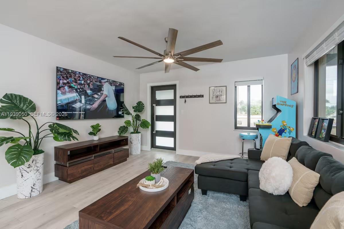 1721 Southwest 11th Terrace Miami, FL 33135 - Photo 28 of 60 a living room with furniture and a wooden floor