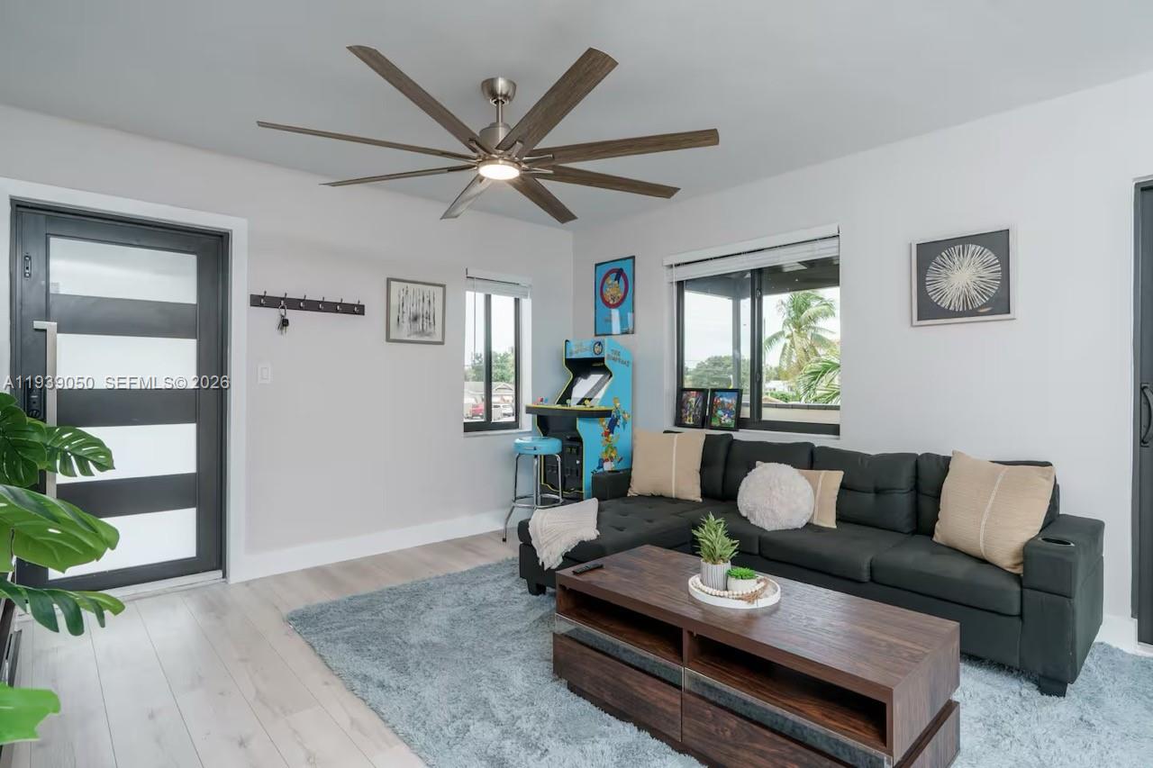 1721 Southwest 11th Terrace Miami, FL 33135 - Photo 29 of 60 a living room with furniture and wooden floor