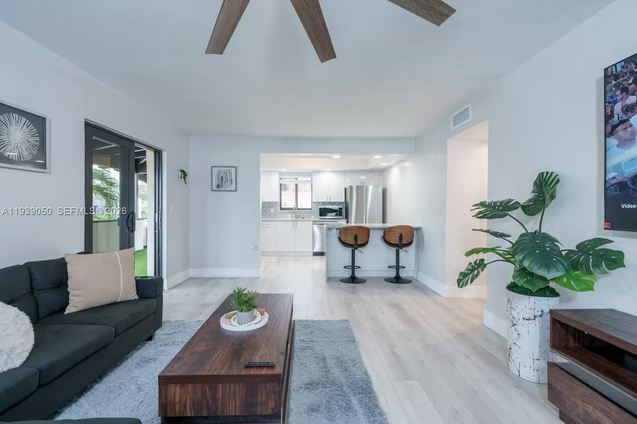 1721 Southwest 11th Terrace Miami, FL 33135 - Photo 30 of 60 a living room with furniture and a wooden floor