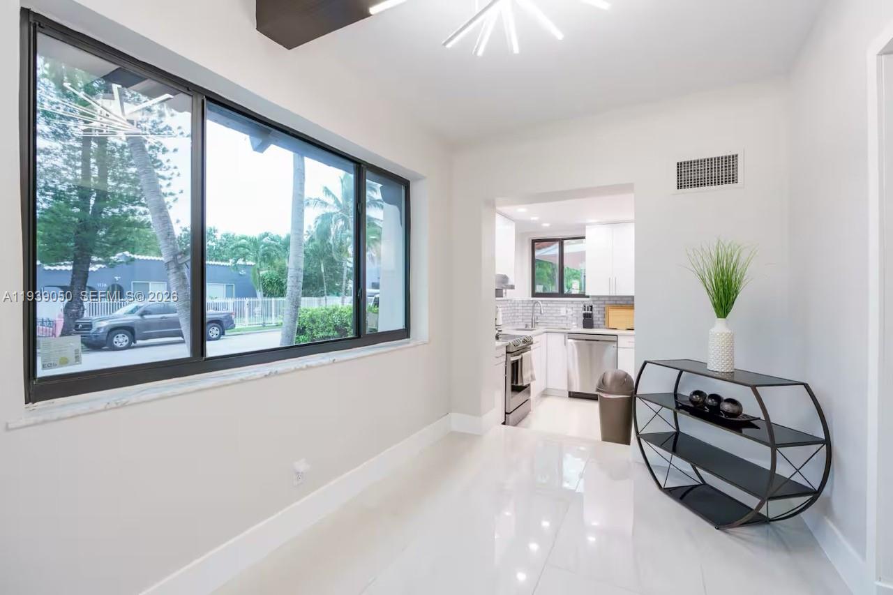 1721 Southwest 11th Terrace Miami, FL 33135 - Photo 3 of 60 a living room with furniture and a large window