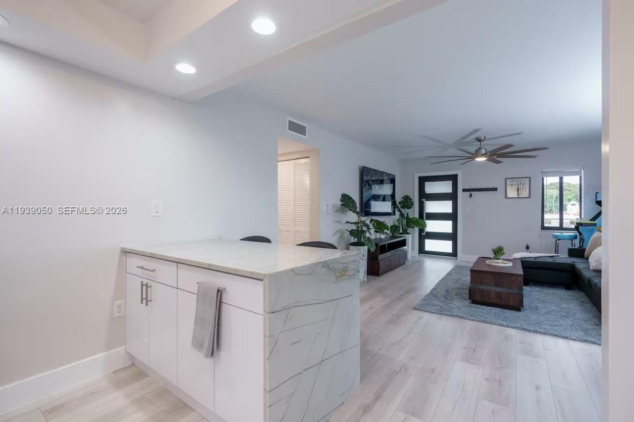 1721 Southwest 11th Terrace Miami, FL 33135 - Photo 31 of 60 a kitchen with a stove and wooden floor