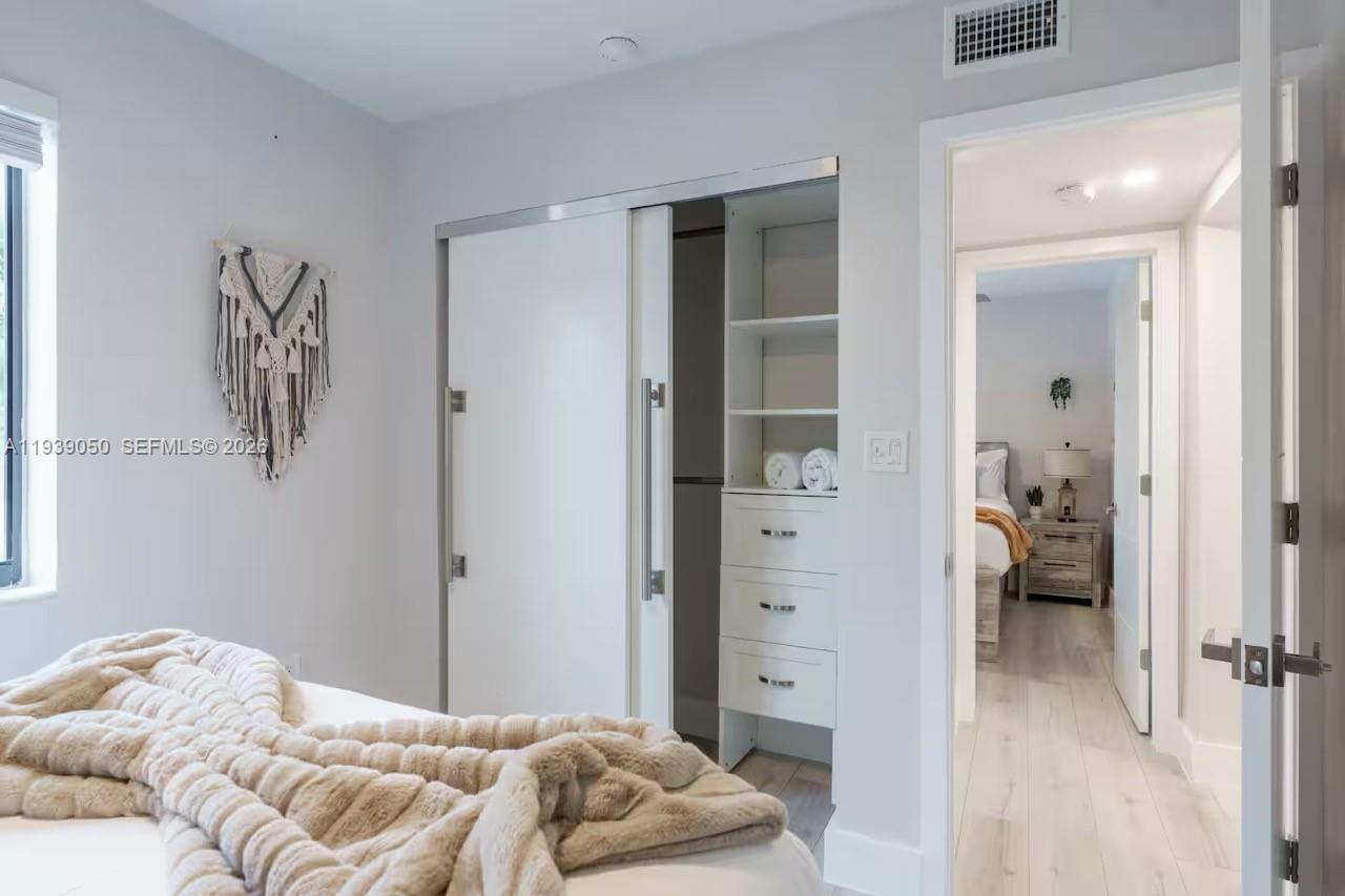 1721 Southwest 11th Terrace Miami, FL 33135 - Photo 38 of 60 a bedroom with a bed and a view of bedroom