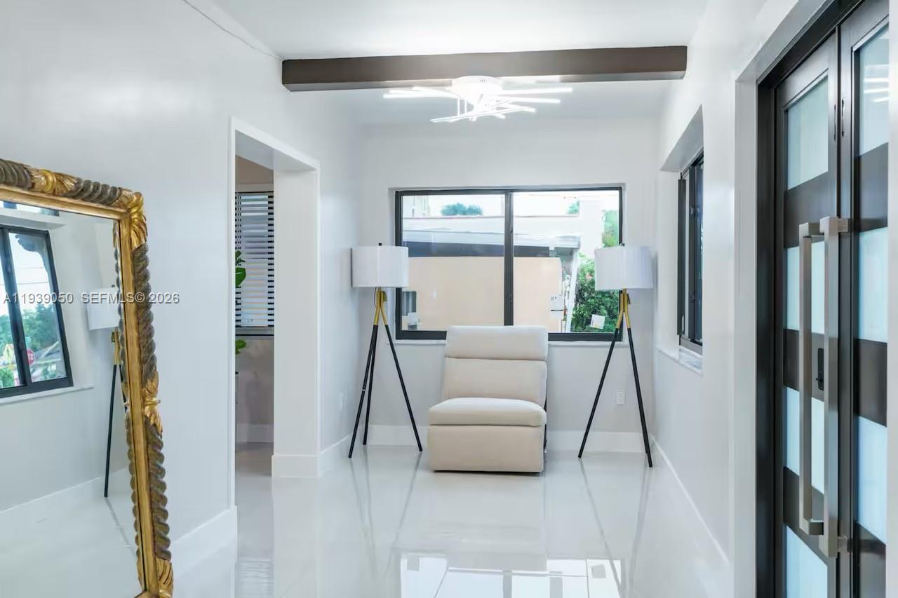 1721 Southwest 11th Terrace Miami, FL 33135 - Photo 4 of 60 a living room with furniture and a large window