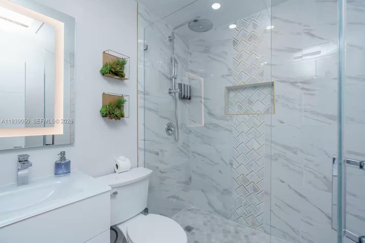 1721 Southwest 11th Terrace Miami, FL 33135 - Photo 41 of 60 a bathroom with a sink toilet and shower