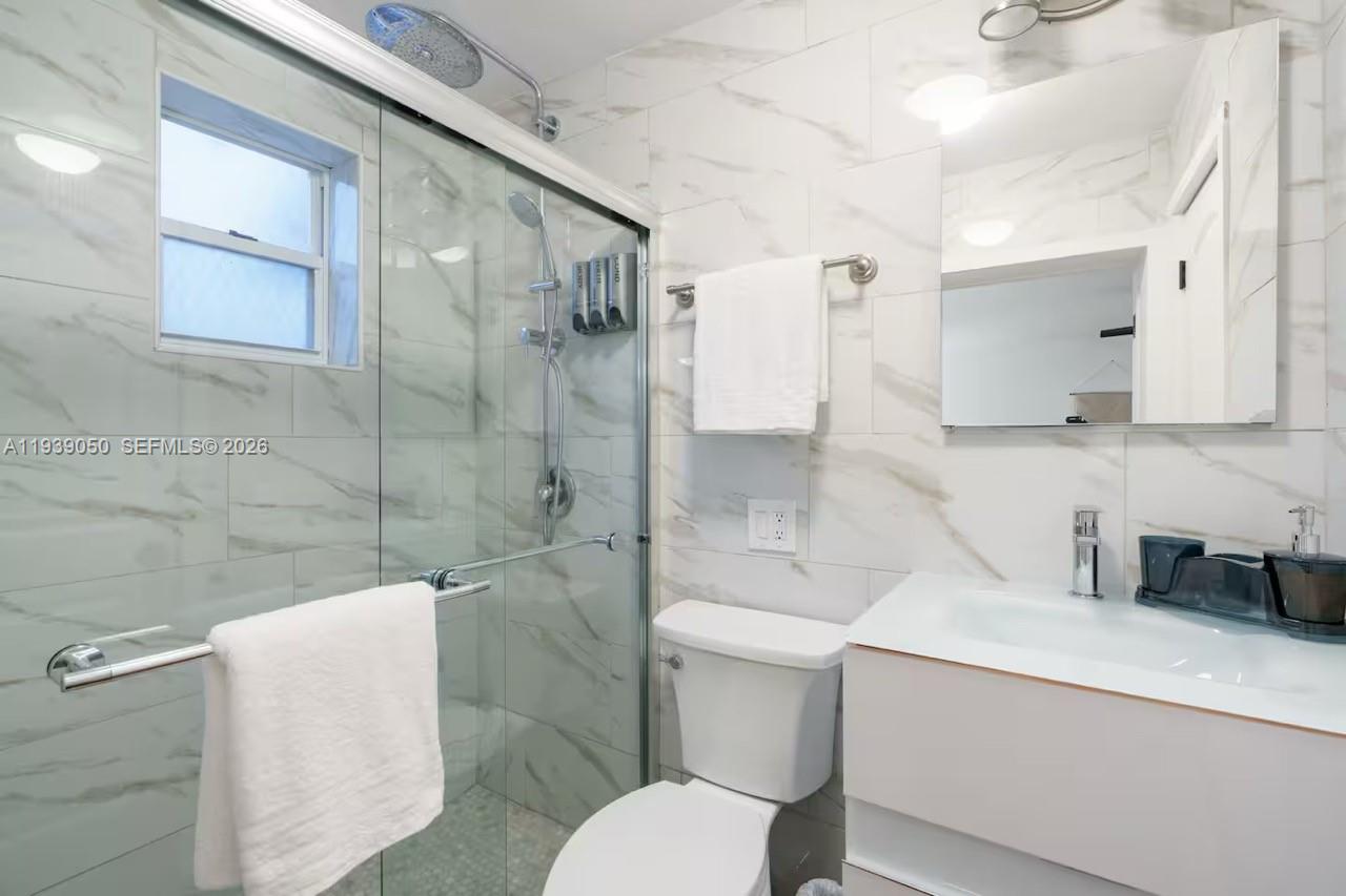 1721 Southwest 11th Terrace Miami, FL 33135 - Photo 57 of 60 a bathroom with a sink toilet and shower