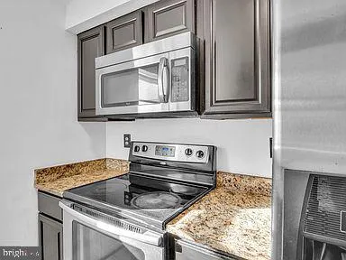 a kitchen with a stove and a microwave